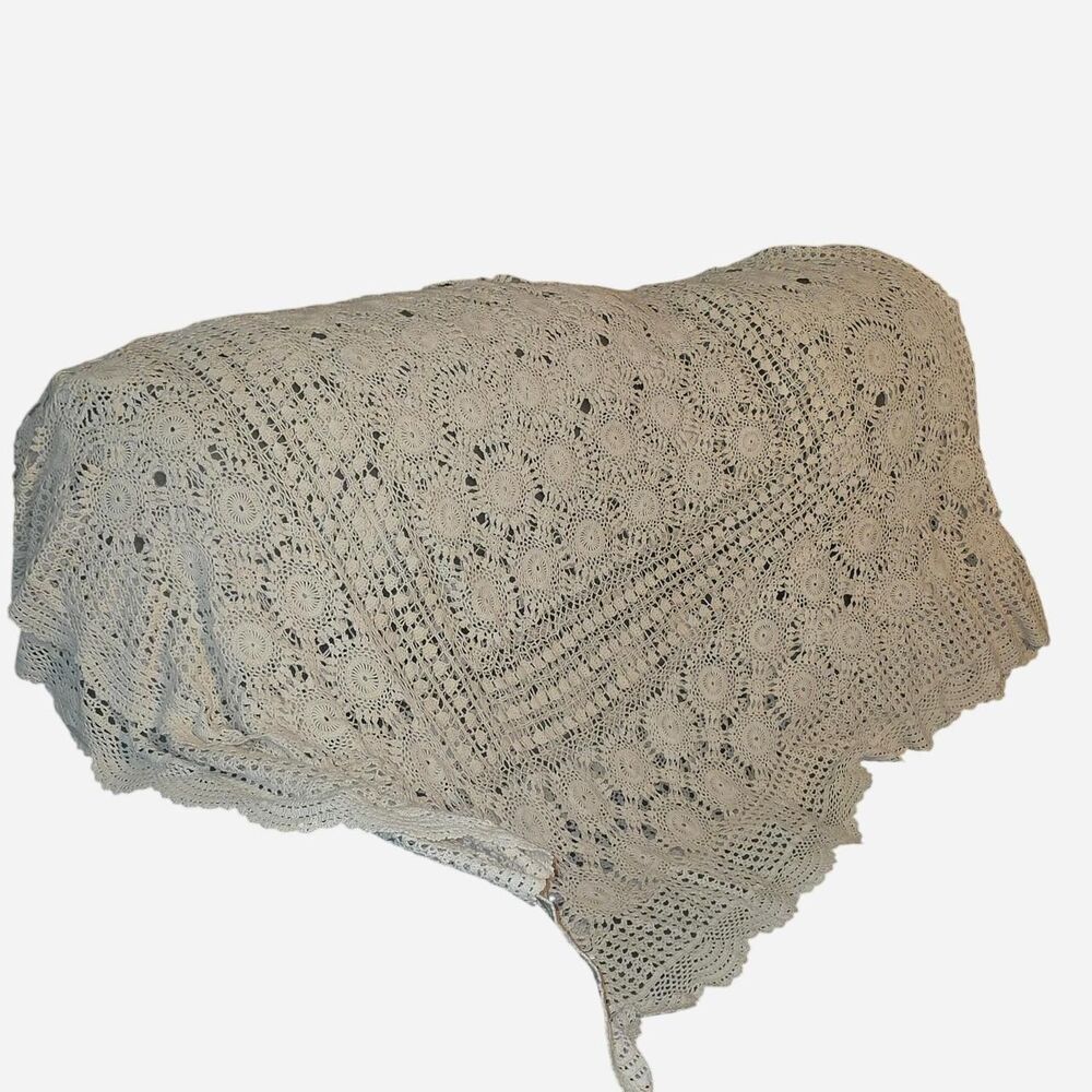 Very old handmade Vintage cream crochet blanket with circular floral motifs.